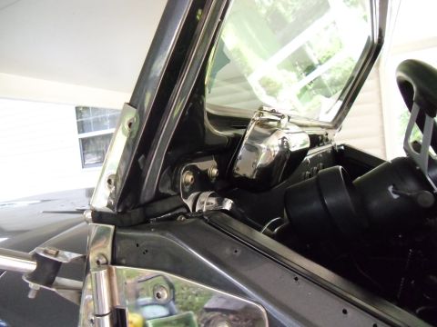 1978 Ford Bronco - Detail shot of the interior, focusing on the windshield frame and mounting hardware.