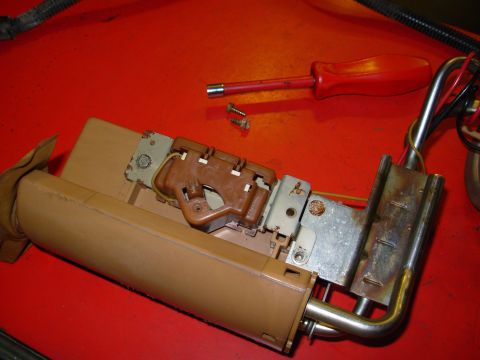 1983 Ford Bronco - Remove these two 1/4" screws and the one below the sender (LEFT in the photo), leaving the one that holds the FDM to the hard lines ab…