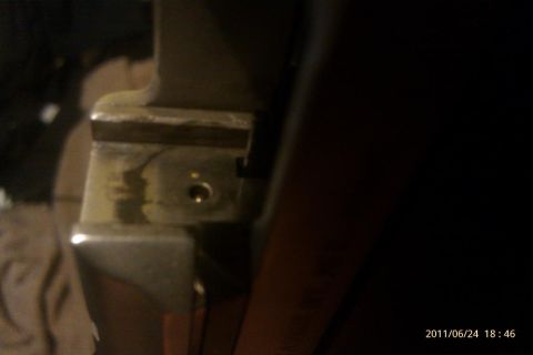 2000 Mercury Grand Marquis - A close-up view of the internal door latch mechanism of a vehicle.