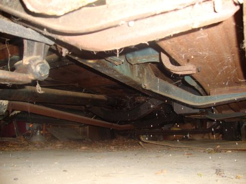 2002 Chevrolet Silverado 1500 - Close-up of the undercarriage, showing frame rails and suspension components.