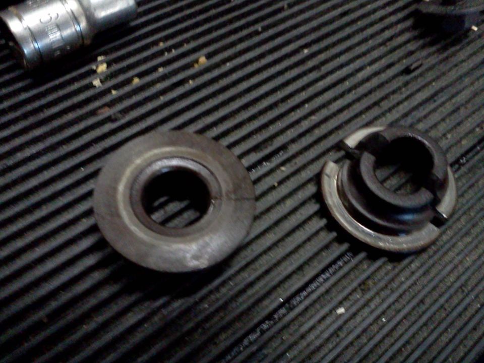 Valve spring retainer and a second retainer with split keepers on a ribbed rubber mat