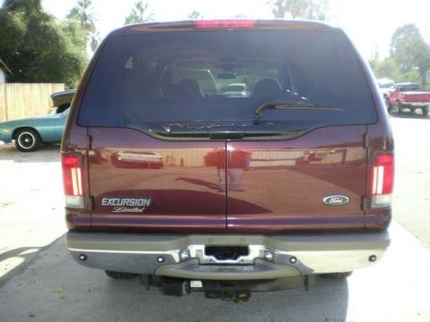 2000 Ford Excursion - Rear view of a maroon 2000 Ford Excursion Limited, showing its distinctive taillights and badging.