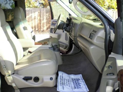 2000 Ford Excursion - Front interior view of a 2000 Ford Excursion, tan leather seats and dashboard details.