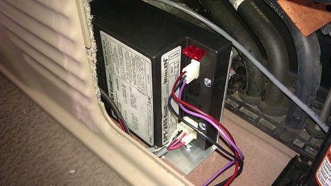 2000 Ford Excursion - Mounted using aluminum brackets to the floor forward of the jack (leaving enough room to remove the jack).