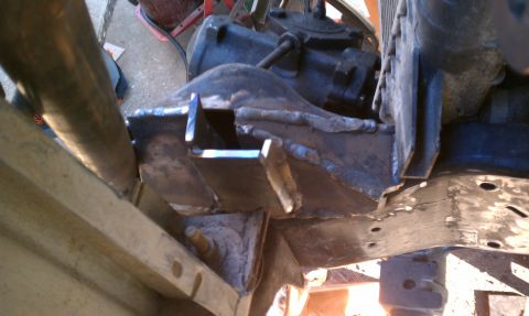 1990 Ford Bronco - Close-up of welded brackets on a vehicle's frame, showing modifications.