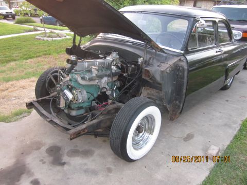 1953 Ford Mainline - 1953 Ford Mainline undergoing engine work, front fenders removed.