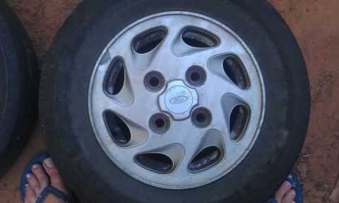 1991 Ford Festiva - A close-up view of a wheel the Ford logo on its center cap.