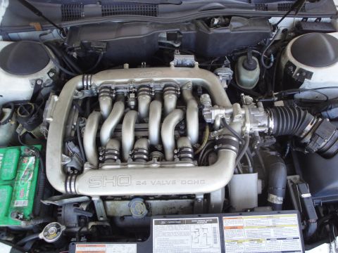 2003 Ford Taurus - Engine bay view of a 2003 Ford Taurus SHO, highlighting the 24 valve DOHC engine.
