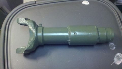 1988 Ford Bronco - Green painted driveshaft yoke and tube assembly, likely a replacement part.