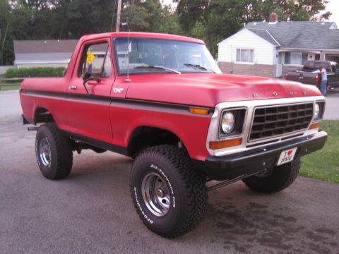 1979 Ford Bronco - This lifted 1979 Ford Bronco features off-road tires and a classic red exterior.