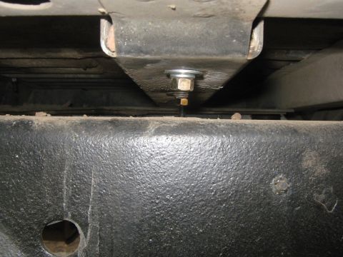 1978 Ford Bronco - Close-up view of a chassis component, showing a bolt and nut assembly.