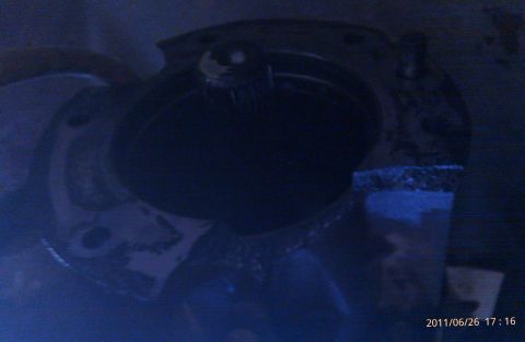 2000 Mercury Grand Marquis - Close-up of an engine component, illuminated by blue light, with a website watermark visible.