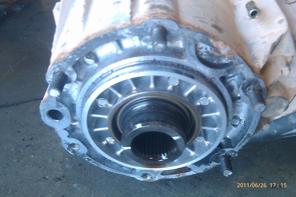 Close-up of a metal differential housing with splined output shaft