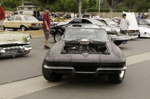 2006 Cadillac STS - A classic 1963 Chevrolet Corvette Sting Ray convertible is displayed with its engine exposed.