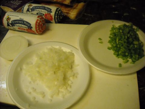 1979 Ford F-150 - Ingredients are prepped for a meal, including sausage, onions, and peppers.