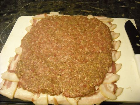 1979 Ford F-150 - A raw meatloaf mixture is prepared on a cutting board, surrounded by strips of bacon.