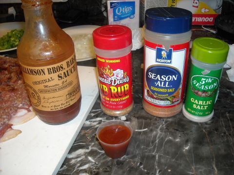 1979 Ford F-150 - A selection of barbecue sauces and seasonings are laid out, ready for a meal.