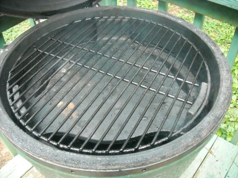 1979 Ford F-150 - The interior of a green ceramic grill, showing the cooking grates and the charcoal basin.