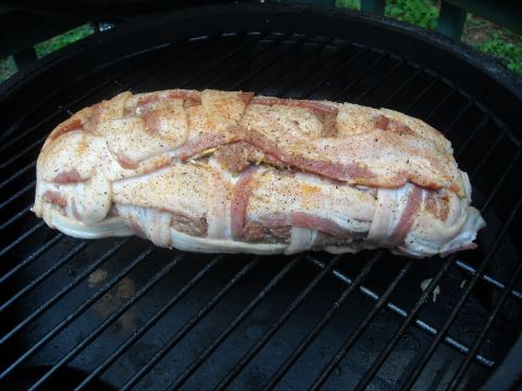 1979 Ford F-150 - A close-up view of a bacon-wrapped meatloaf on a grill, ready for cooking.