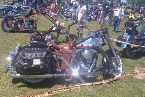 1991 Ford LTD Crown Victoria - A gathering of motorcycles on a sunny day, with various custom bikes and attendees visible.