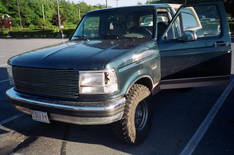 1994 Ford Bronco - This 1994 Ford Bronco is shown with its driver's side door open, revealing the interior.