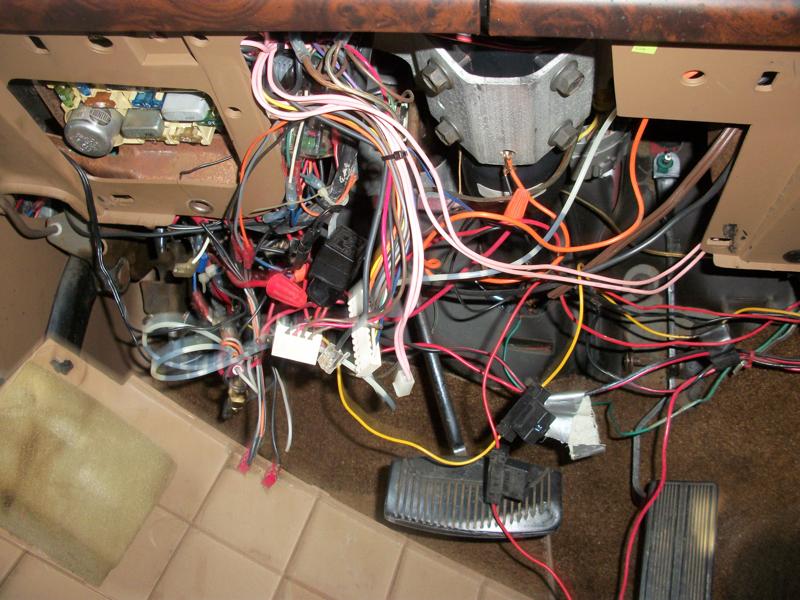 Vehicle interior wiring harness with many colorful wires and connectors