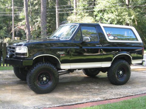 1993 Ford Bronco - This black and white Ford Bronco has a lifted suspension and large off-road tires.