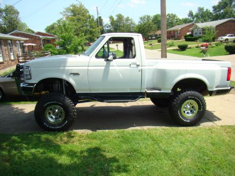 1995 Ford F-150 - well as you can see in the pic, its sitting a little front high. we ended up getting more lift out of it than expected! when the coils sett…
