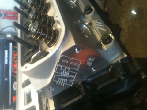 1993 Ford Bronco - Close-up of an engine cylinder head, showing the H&R logo and displacement marking.