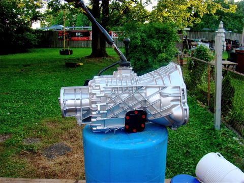 1995 Ford F-150 - after cleaning the pto covers, and painting those black, bolts red. trans has been primed, and painted in high temp engine block paint. the…