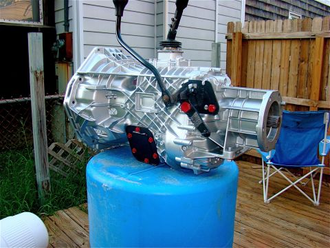1995 Ford F-150 - after cleaning the pto covers, and painting those black, bolts red. trans has been primed, and painted in high temp engine block paint. the…
