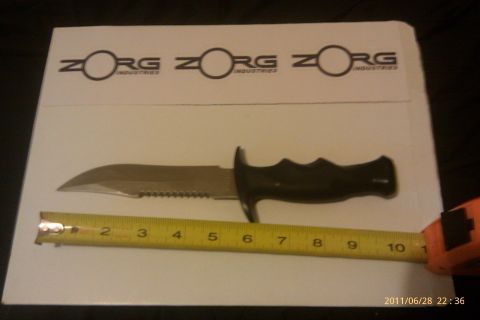2000 Mercury Grand Marquis - A knife is shown next to a measuring tape, with the Zorg Industries logo visible above.