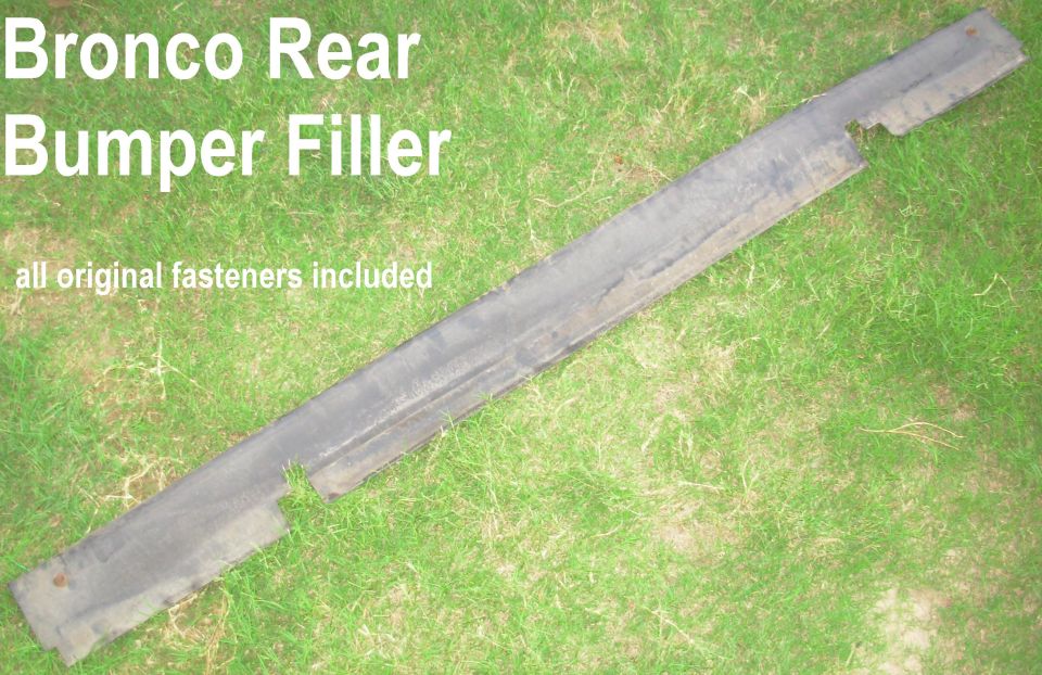 Bronco rear bumper filler panel lying on grass