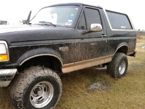 1994 Ford Bronco - This muddy 1994 Ford Bronco is equipped for off-road adventures with its lifted suspension and large tires.