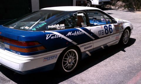 1990 Ford Probe - This 1990 Ford Probe is set up for racing with extensive decals and a roll cage visible.