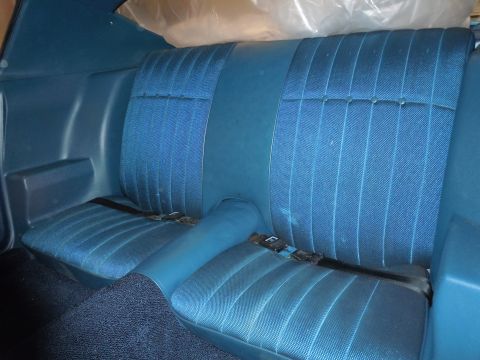 1972 Chevrolet Camaro - Interior view of blue patterned rear car seats and carpet.