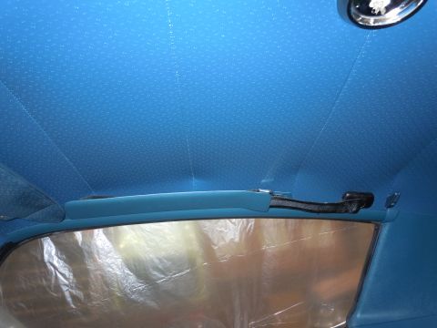 1972 Chevrolet Camaro - The blue patterned headliner and rear window area of a vehicle interior are visible.