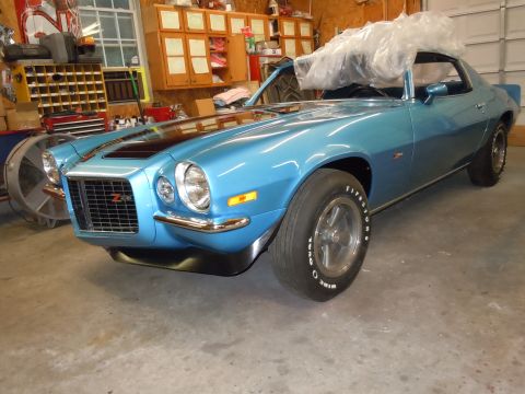 1972 Chevrolet Camaro - A blue 1970 Chevrolet Camaro Z28 is shown from a three-quarter front angle in a garage setting.