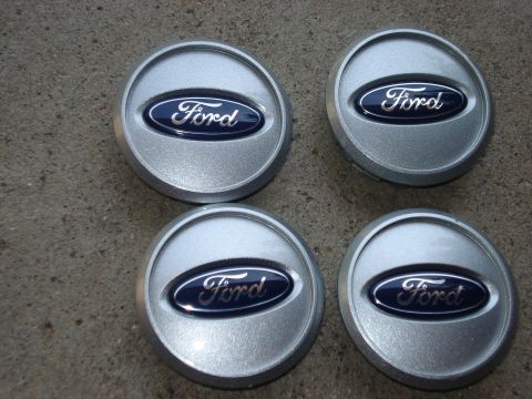 2000 Ford Crown Victoria - Set of four silver Ford center caps the blue oval logo.