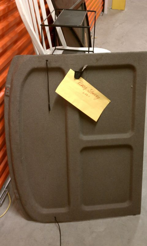 1990 Ford Probe - Trunk liner with a handwritten tag attached.