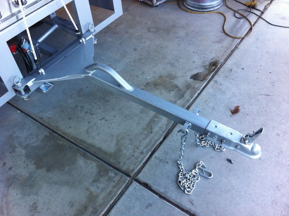 Trailer hitch assembly with chains and coupler
