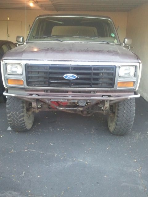 1982 Ford Bronco - This Ford Bronco has a custom bumper and off-road tires, suggesting modifications beyond its original factory appearance.