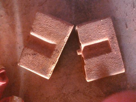 1995 Ford Bronco - Two brake pads, likely for a vehicle, are shown close-up. The registry claims they are for a 1995 Ford Bronco, but this cannot be confirmed…