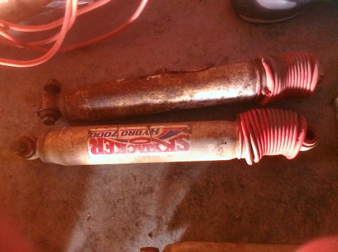 1995 Ford Bronco - Pair of Skyjacker Hydro 7000 shock absorbers shown, one is rusty.