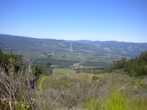 2005 Jeep Wrangler - A scenic vista of a valley with power transmission towers stretching across the landscape towards a mountain range.