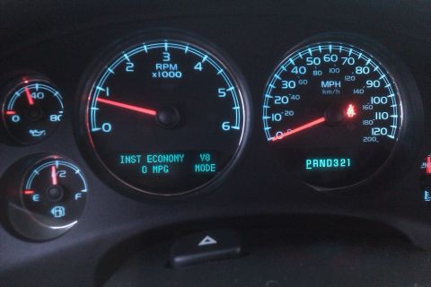 2007 Chevrolet Tahoe - Instrument cluster with tachometer, speedometer, fuel gauge, and economy display.