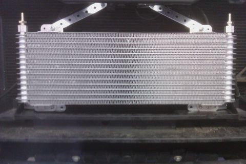 2007 Chevrolet Tahoe - A transmission cooler is shown, mounted in front of the vehicle's radiator.