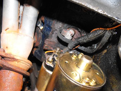 1986 Ford Bronco - Down below you put the old starter's 2 gauge wire onto the big stud. The little stud gets a new wire (orange) that you feed up to the old s…