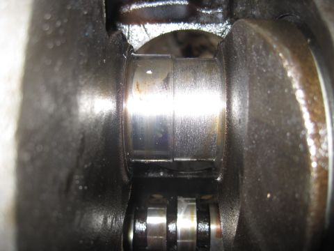 1979 Ford Bronco - Close-up view of engine crankshaft bearings, showing wear and potential damage.