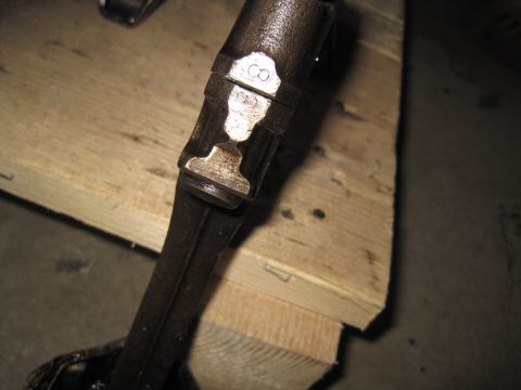 1979 Ford Bronco - Close-up of an engine connecting rod showing stamped identification marks.